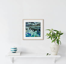 Framed abstract artwork on a white wall with decorative items below.