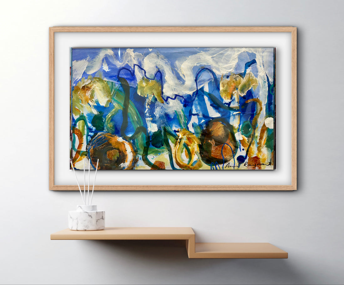 Framed abstract blue and earthy coloured painting on a wall above a wooden shelf.